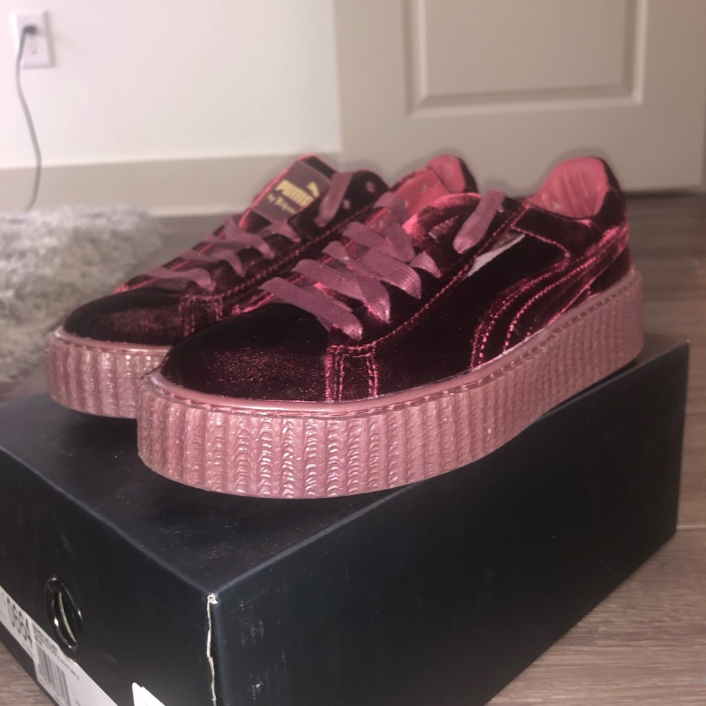 Rihanna Fenty Puma’s, in burgundy.